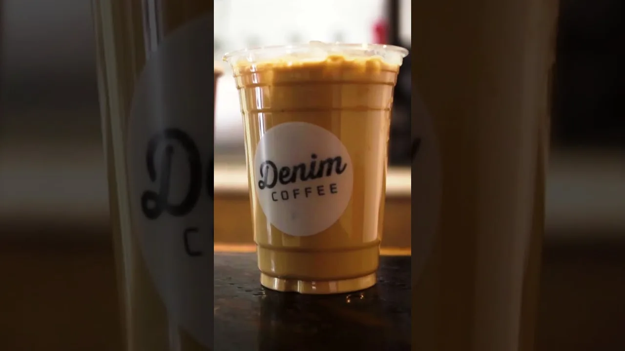 denim coffee branded iced beverage in clear plastic cup on counter., denim coffee, carlisle