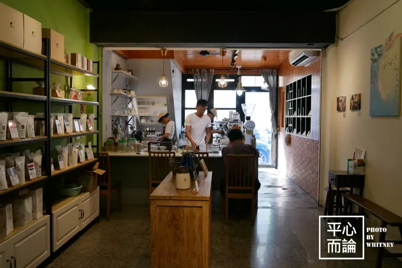 cozy café interior with green shelving, wooden counter, and barista serving customers., 出軌咖 derail coffee roasters, taichung
