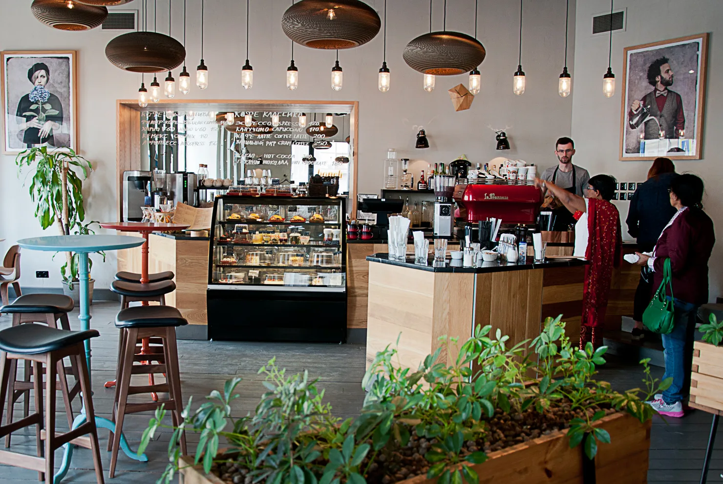 modern café interior with counter, pastries, pendant lights, and customers ordering coffee., dirty lights coffee company, st.
