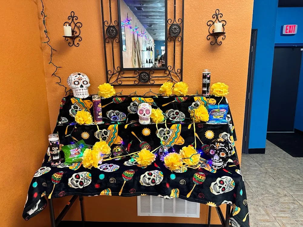 day of the dead altar with skull decorations, yellow flowers, and colorful ornaments., d.o.d. coffee roastery, clearwater