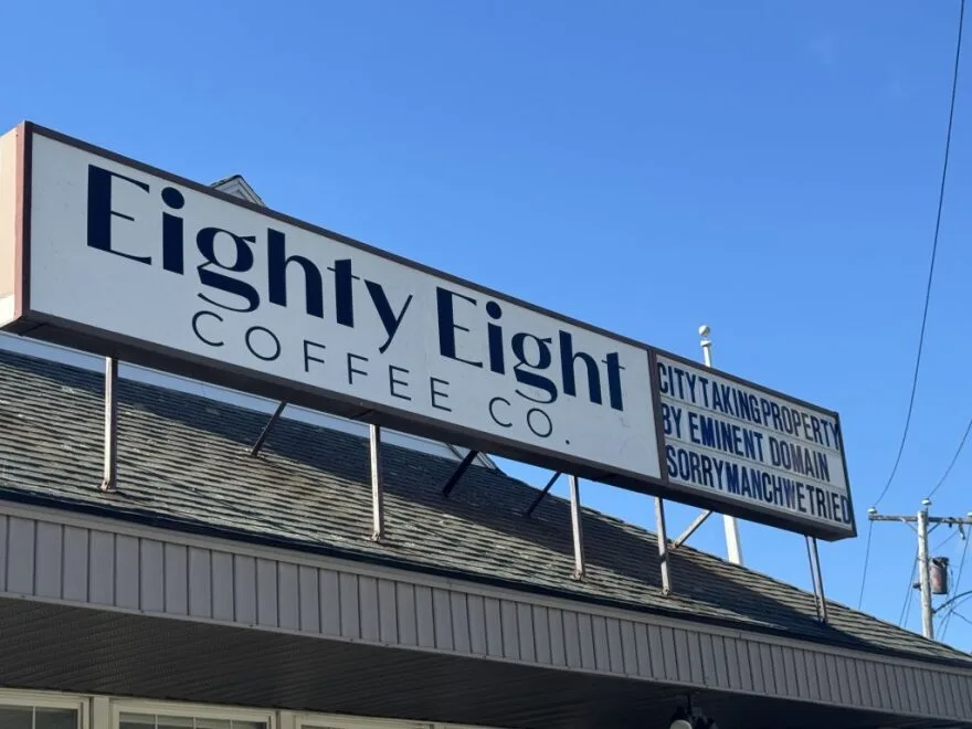 eighty eight coffee co. storefront sign with city taking property notice attached., eighty eight coffee, manchester