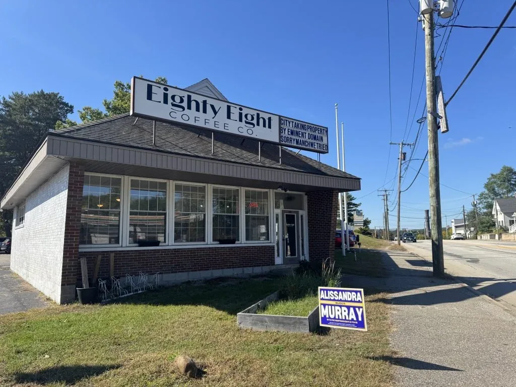eighty-eight coffee co storefront with brick exterior and political campaign sign., eighty eight coffee, manchester