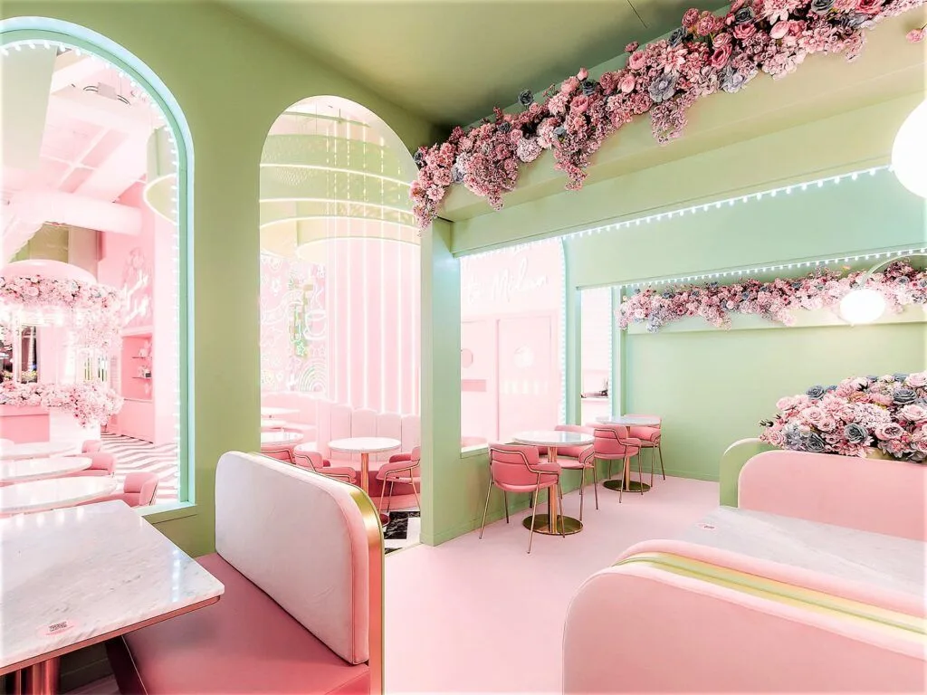 pastel pink and green interior space with floral decorations and modern furniture., el&n gae aulenti, milan
