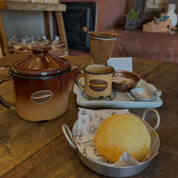 vintage tea set with pot, cup, pastry and accessories on wooden table., empório coisas de minas, são paulo