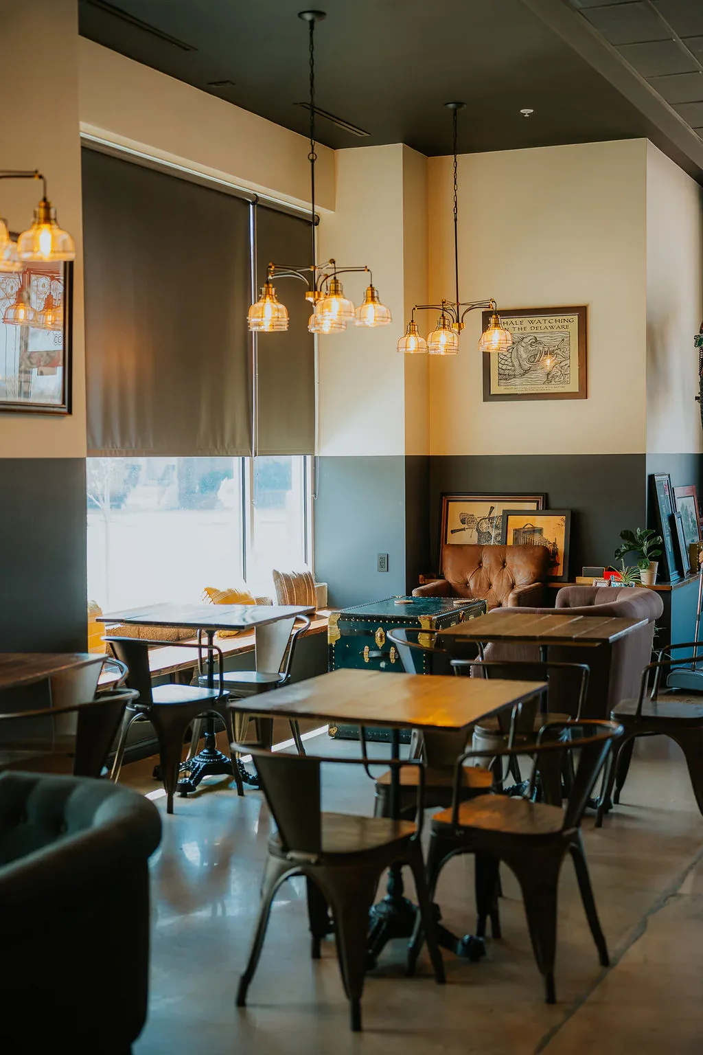 modern café interior with pendant lights, wood tables, and teal wall accents., evermore coffee roasters, philadelphia