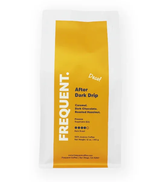 yellow coffee bag labeled "after dark drip" decaf from frequent coffee company., frequent coffee, san diego
