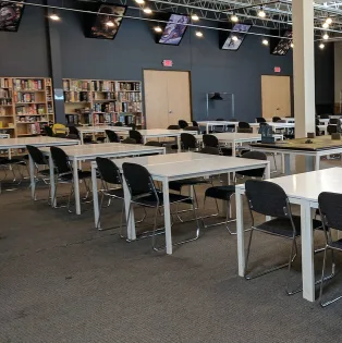 modern office workspace with collaborative tables, ergonomic chairs, and shelving., gamezenter, roseville