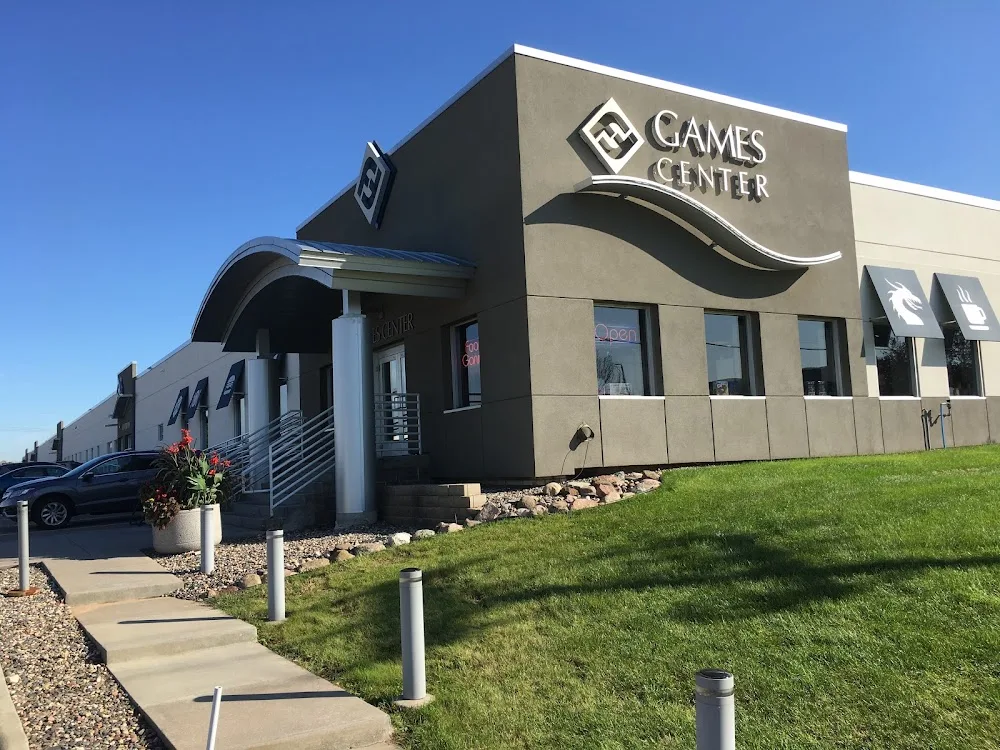 games center storefront with modern architecture and manicured landscaping under clear sky., gamezenter, roseville