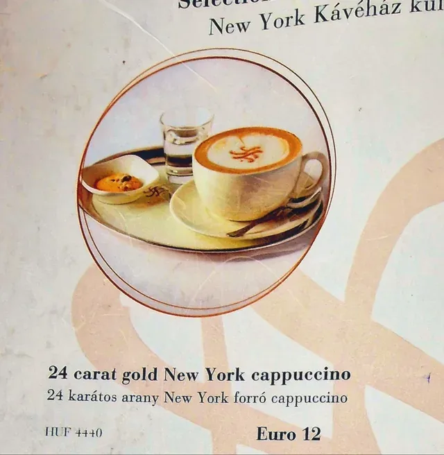 24 carat gold new york cappuccino with pastry and water glass on saucer., gold coffee, new york city