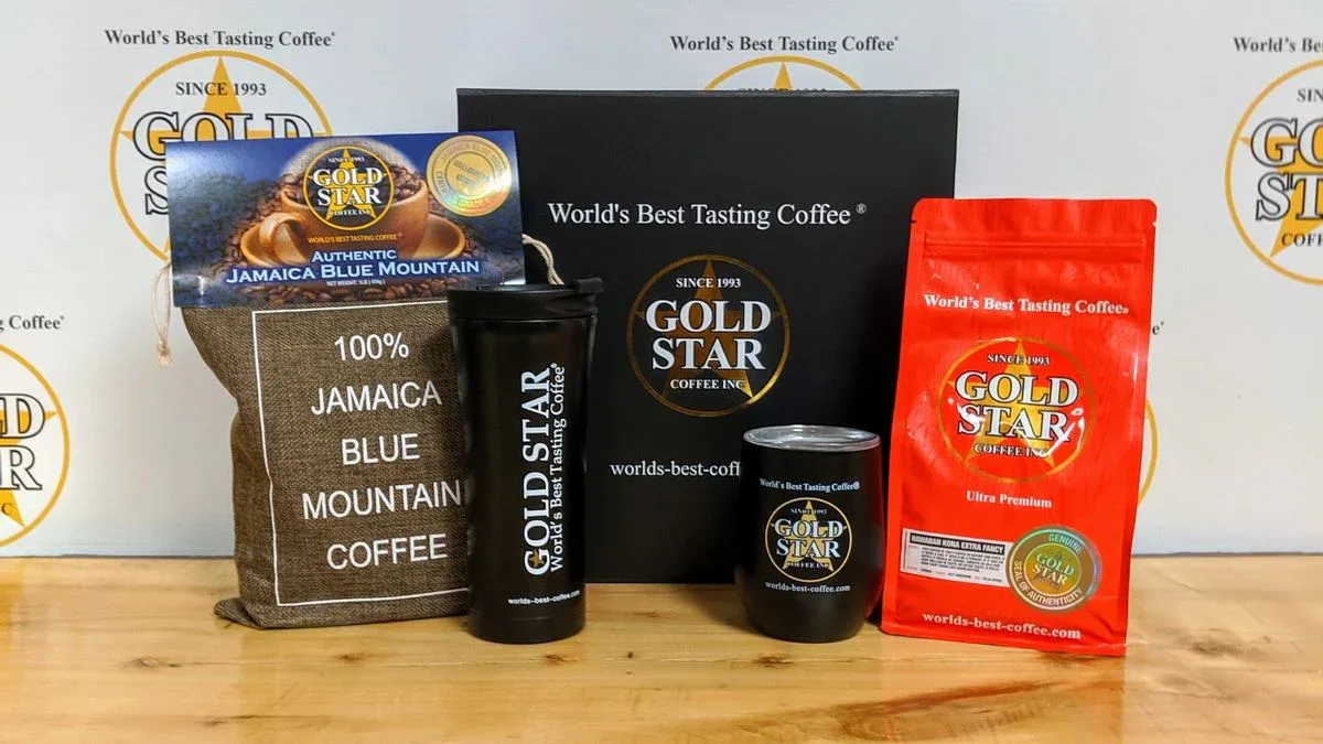gold star coffee products displayed with branded packaging and black merchandise on wooden surface., gold star coffee, hempst