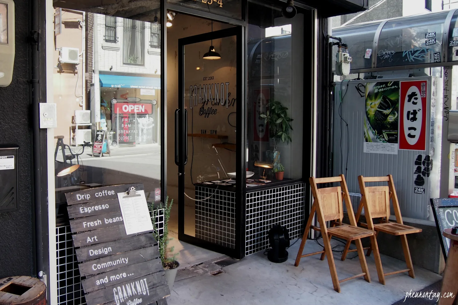 modern coffee shop storefront with wooden chairs and minimalist black tile design., granknot coffee, osaka
