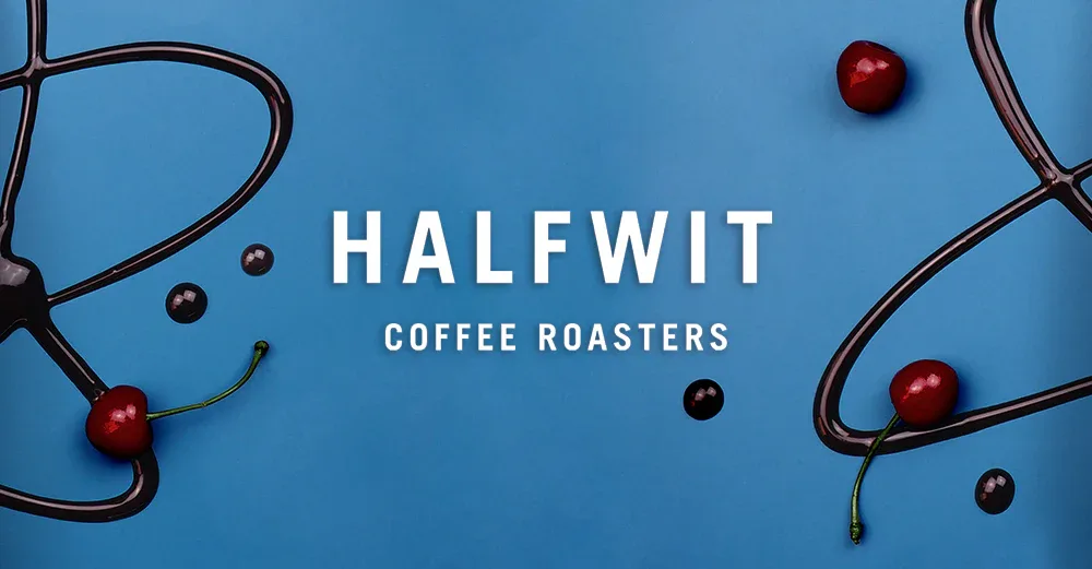 halfwit coffee roasters logo on blue background with decorative coffee bean vines., halfwit coffee roasters, chicago