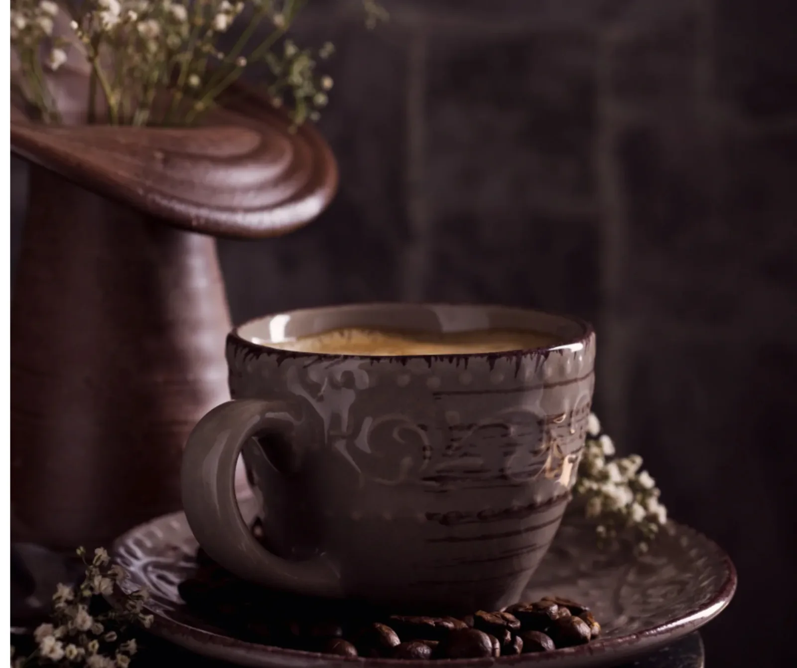ornate ceramic cup with coffee, saucer, coffee beans, and dried flowers., headframe coffee, ely