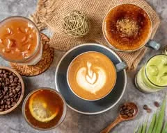 coffee cups with latte art, pastries, and ingredients arranged on marble surface., hitokuchi coffee, taipei