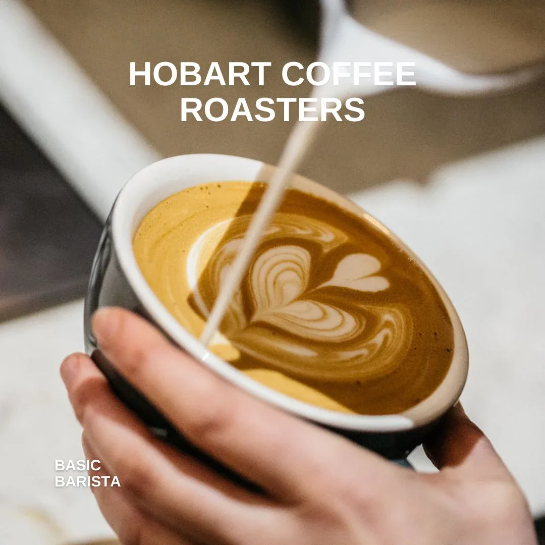 hand pouring steamed milk into espresso cup with latte art design., hobart coffee roasters, hobart