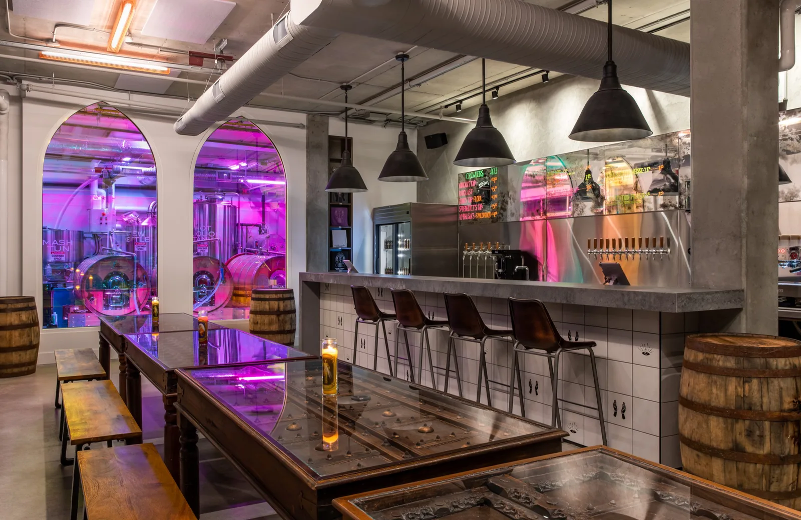 modern brewery interior with purple neon lighting and wooden barrel accents., house of funk brewing, north vancouver