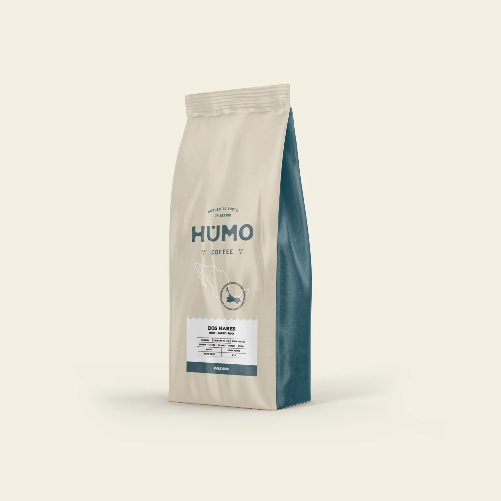 cream-colored coffee bag with teal accents labeled "humo coffee" and "dos mares.", humo coffee, texas