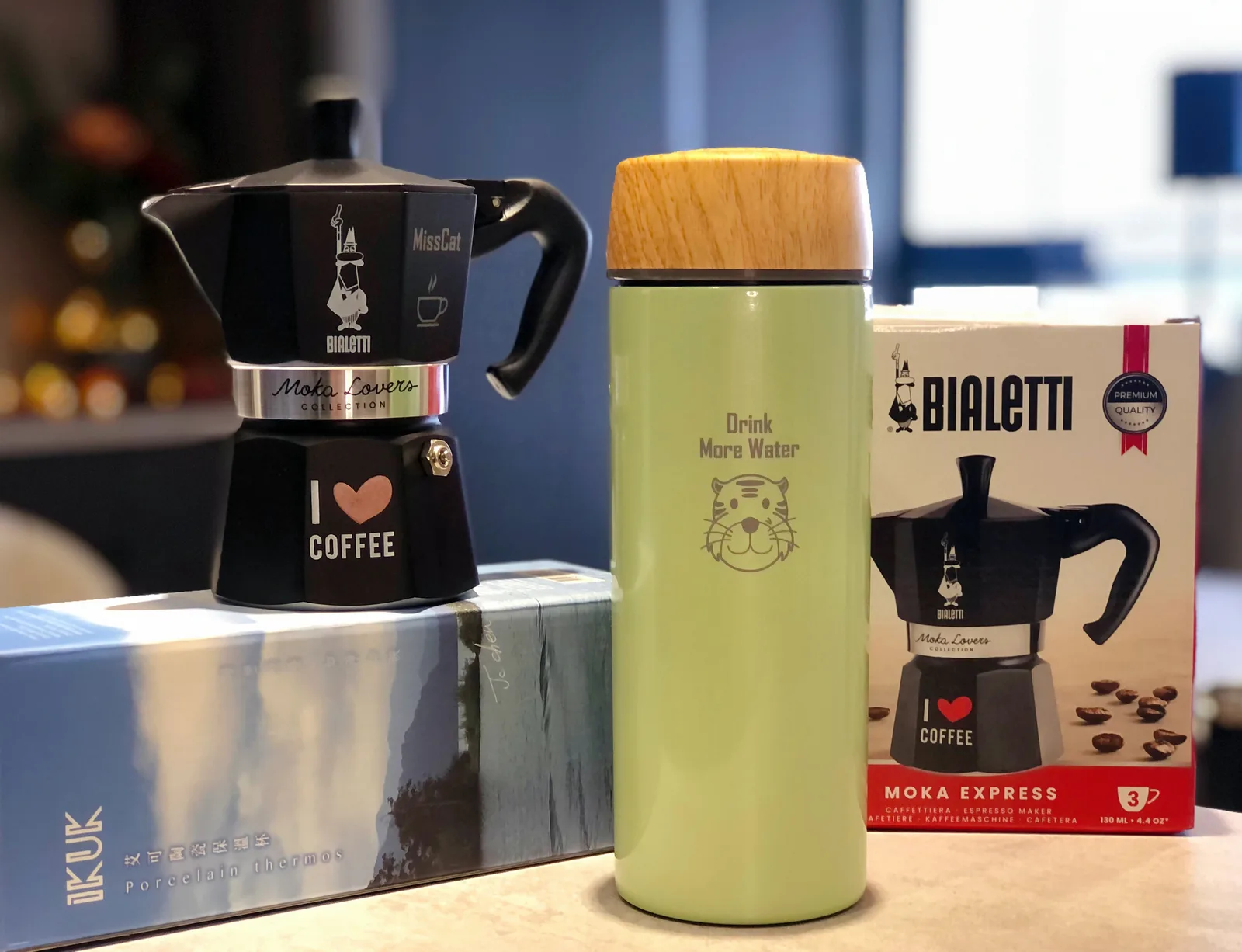 black bialetti moka express pot, green water bottle, and bialetti product box displayed together., ikuk艾可陶瓷保溫杯/bialetti摩卡壺, t