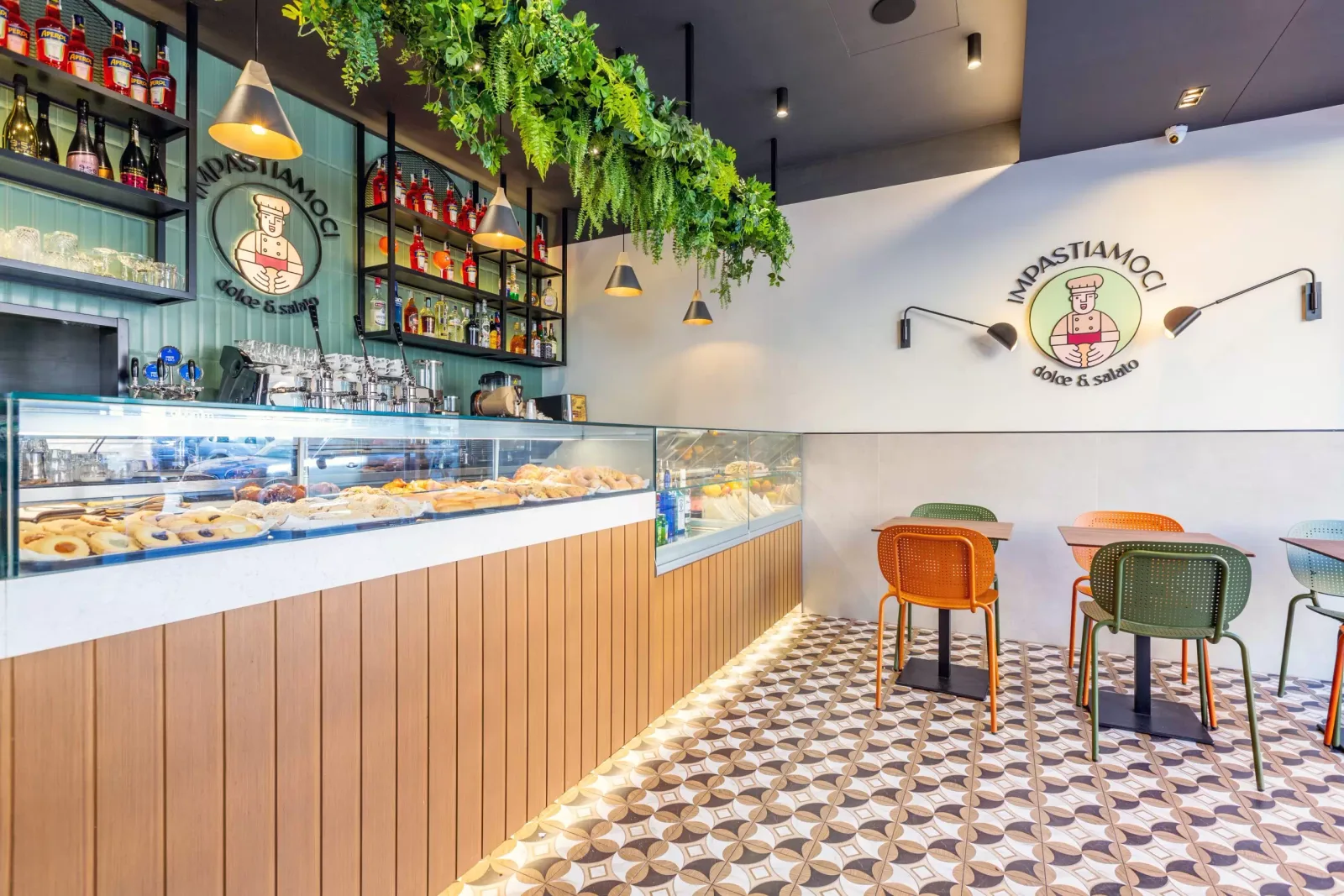 modern italian bakery with pastries, colorful chairs, and hanging plants., impastiamoci, rome