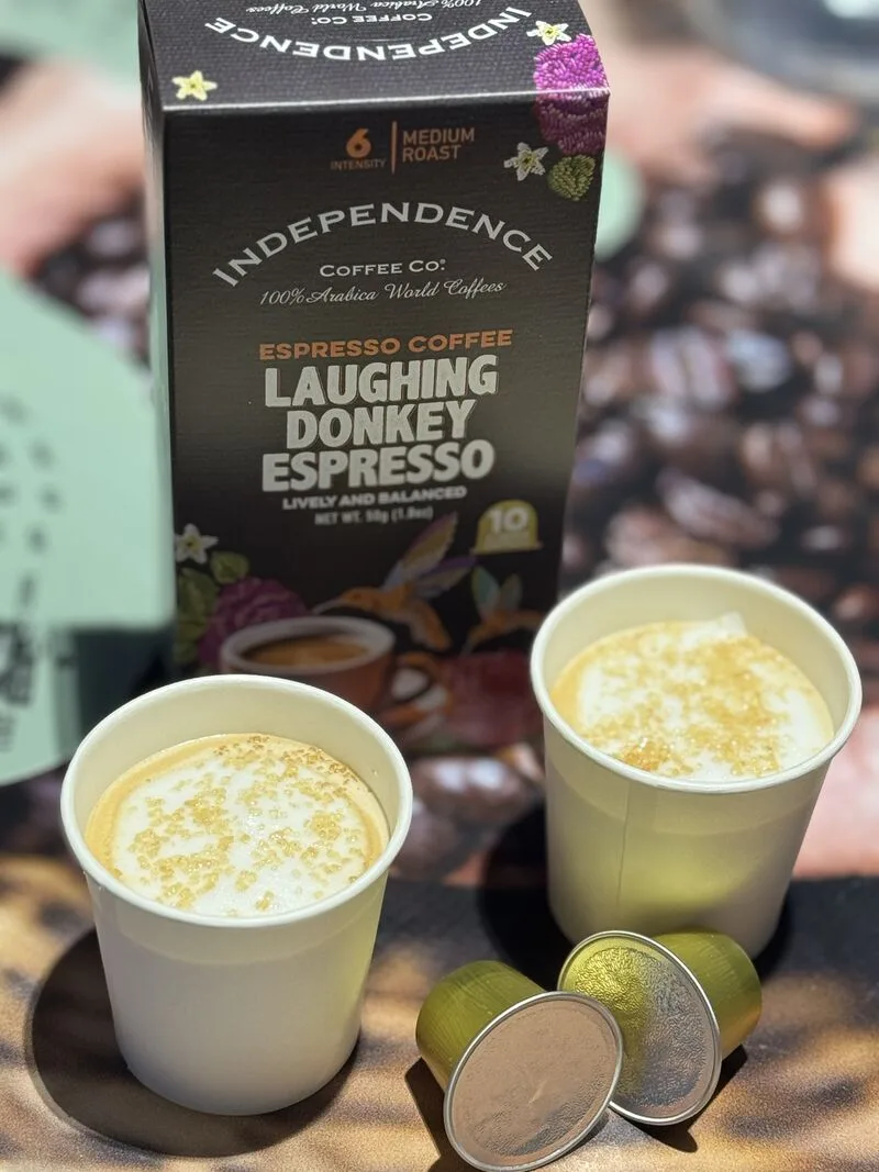 independence coffee co. laughing donkey espresso with two prepared cups and capsules., independence coffee co. headquarters, 