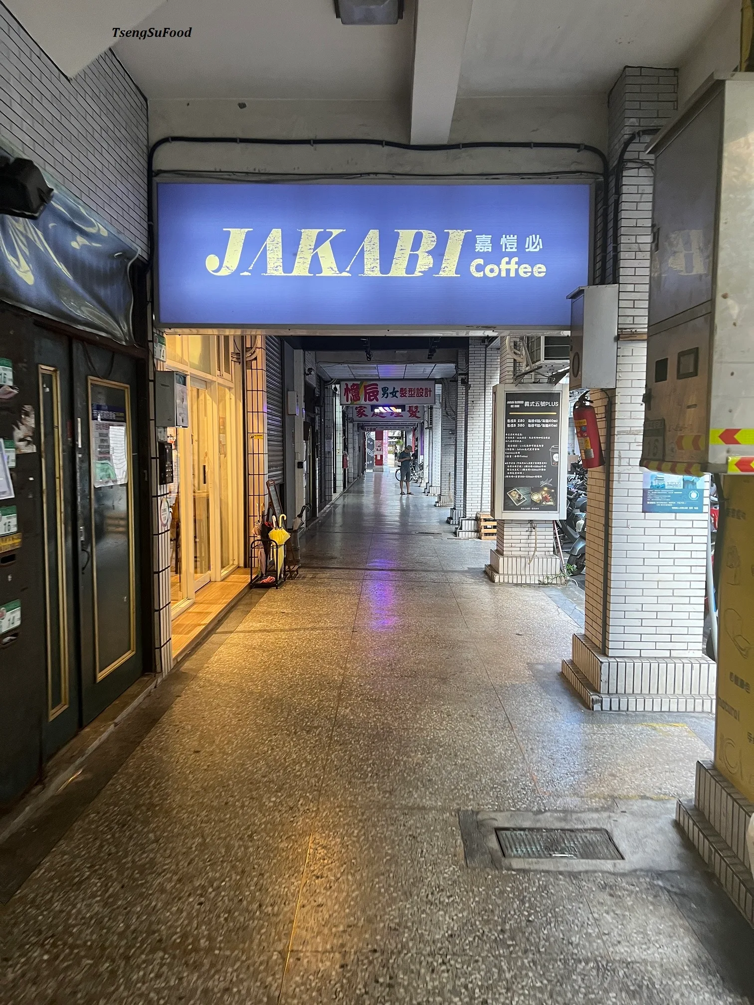 indoor shopping arcade with illuminated jakabi coffee storefront sign in blue and gold., jakabi coffee 嘉愷必咖啡, taipei