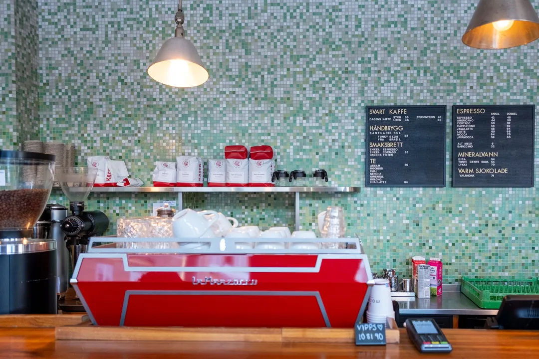 modern scandinavian café interior with red espresso machine and mosaic tile wall., java espresso & coffee business as, oslo