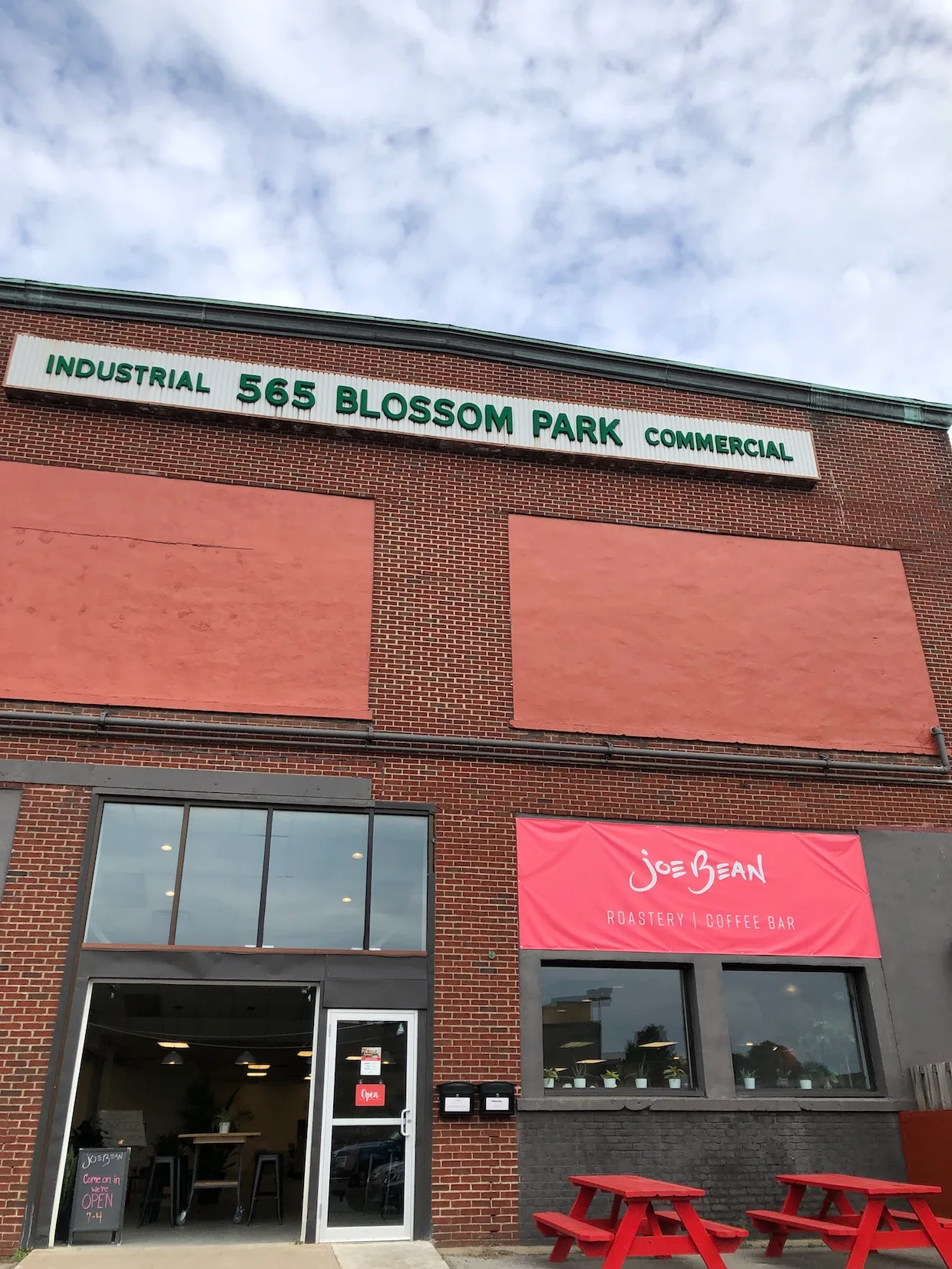 joe bean roastery coffee bar storefront in industrial 565 blossom park commercial building., joe bean roasters, rochester