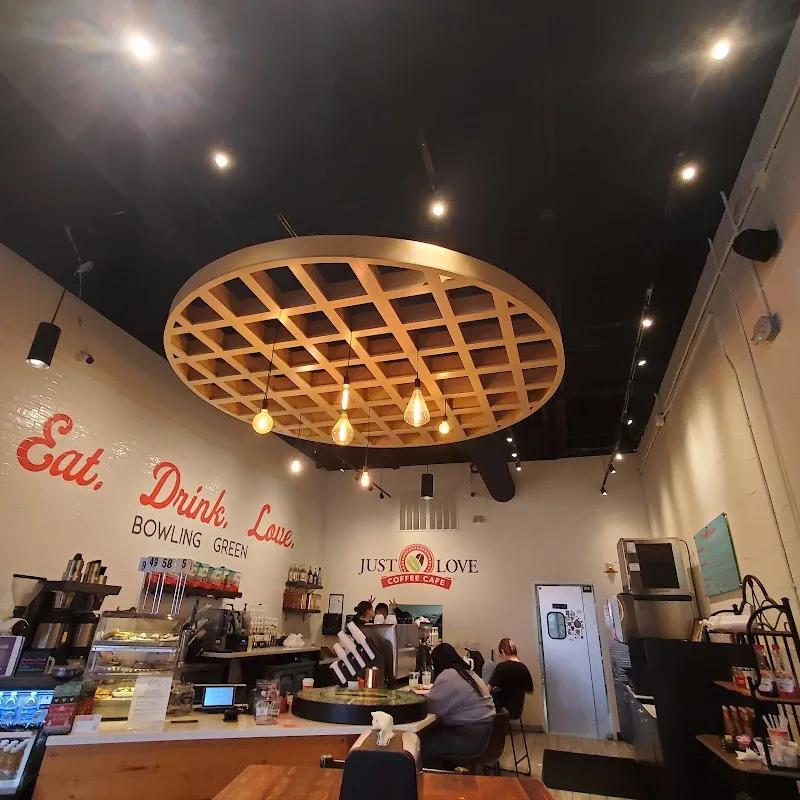 modern café interior with wooden lattice ceiling fixture and red "eat, drink, love" signage., just love coffee cafe - bowling