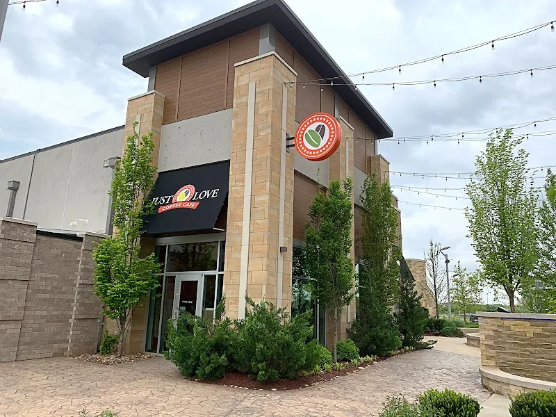 modern restaurant building with "just love" branding and round red logo sign., just love coffee cafe - the fountains at gatew