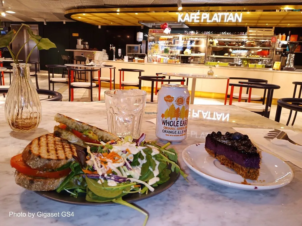 burger and dessert plated at kafe flattan café with sparkling beverage., kafé plattan, stockholm