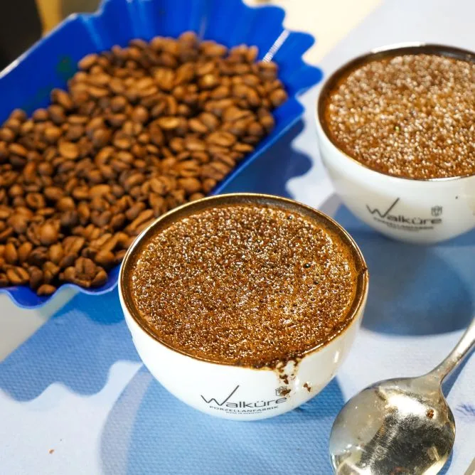 peanuts in blue dish with two bowls of peanut butter and spoon., kaffeekirsche, berlin