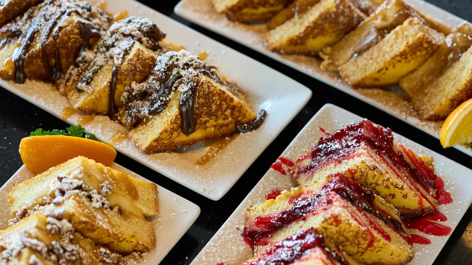 french toast slices with powdered sugar, chocolate drizzle, and berry toppings on white plates., keke's breakfast cafe, miami