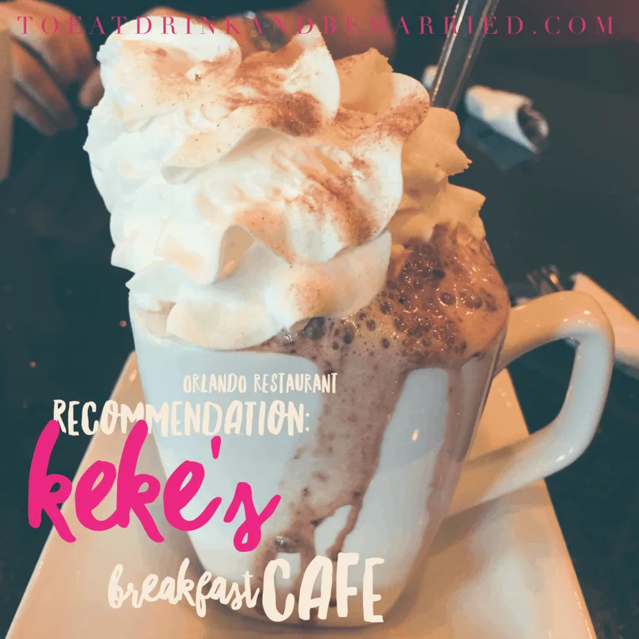 creamy chocolate beverage topped with whipped cream and cinnamon in white mug., keke's breakfast cafe, orlando