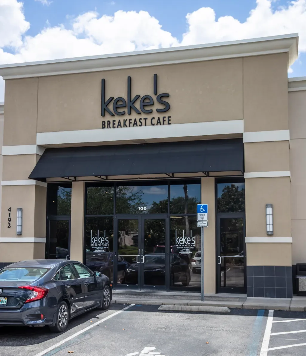 keke's breakfast cafe storefront with tan facade and black awning., keke's breakfast cafe, orlando