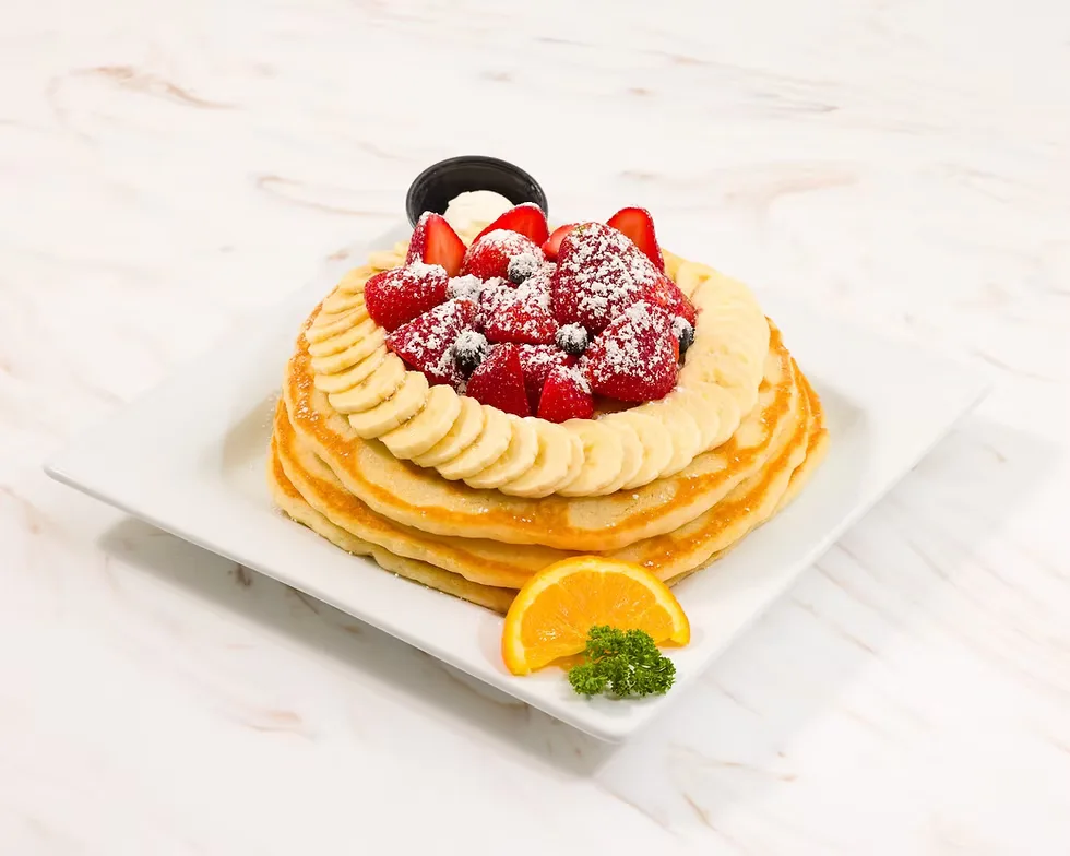 elegant dessert pastry topped with raspberries, cream, and powdered sugar on white plate., keke's breakfast cafe, port saint 