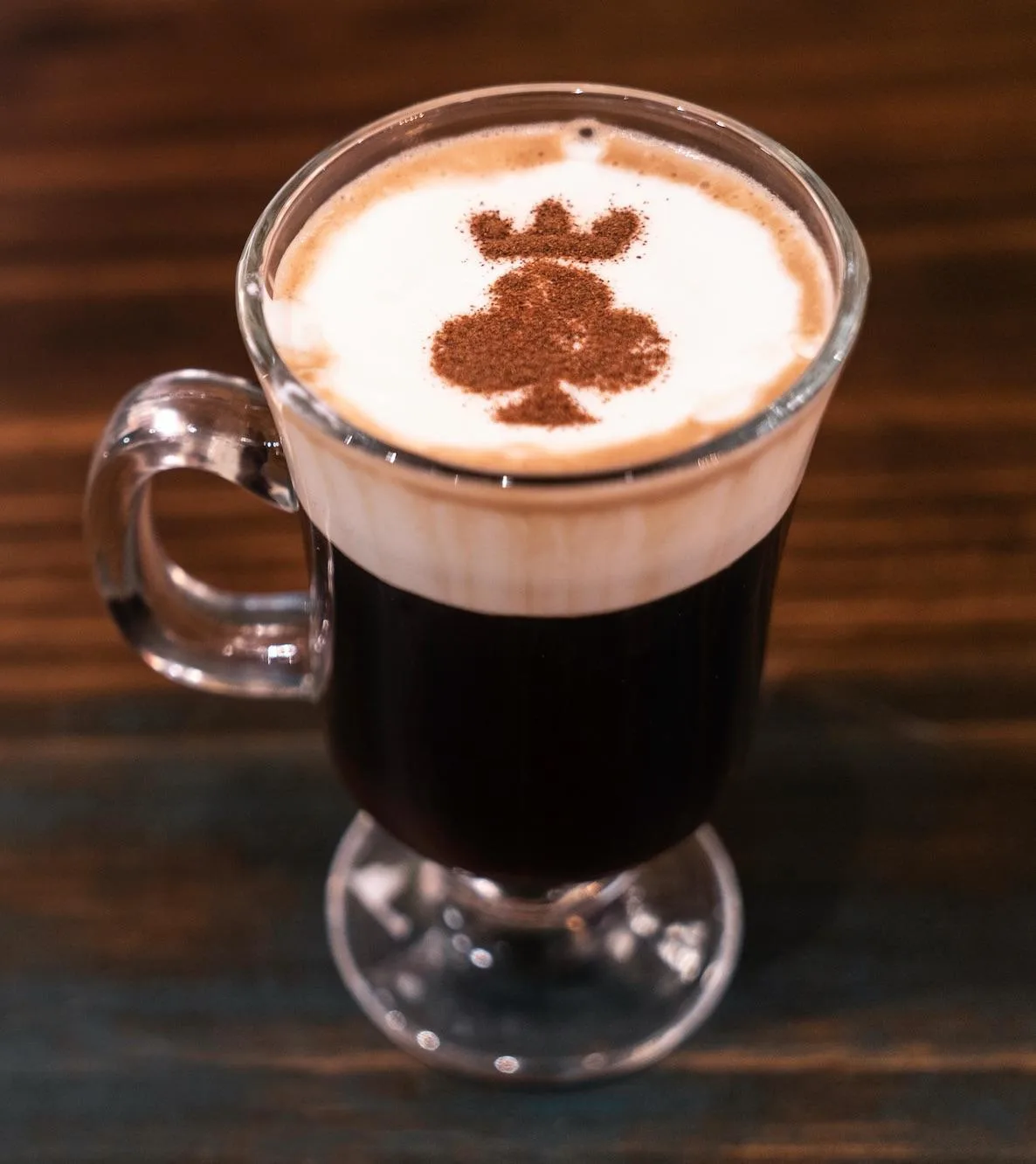 dark coffee with creamy foam topped with club suit latte art design., king of clubs coffee & kombucha, virginia