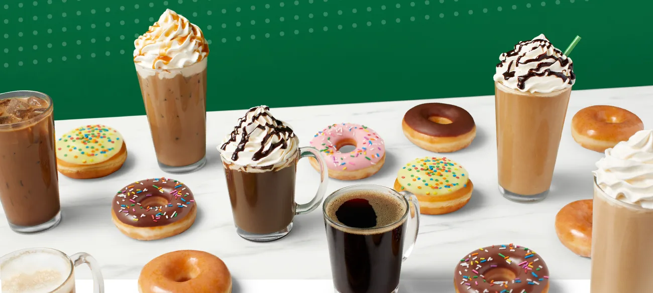 coffee drinks and donuts arranged on white surface against green background., krispy kreme, melbourne