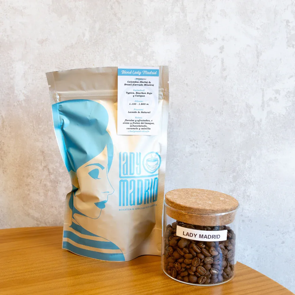 blend lady madrid coffee bag and glass jar filled with roasted beans on wooden table., lady madrid roaster y speciality coffe