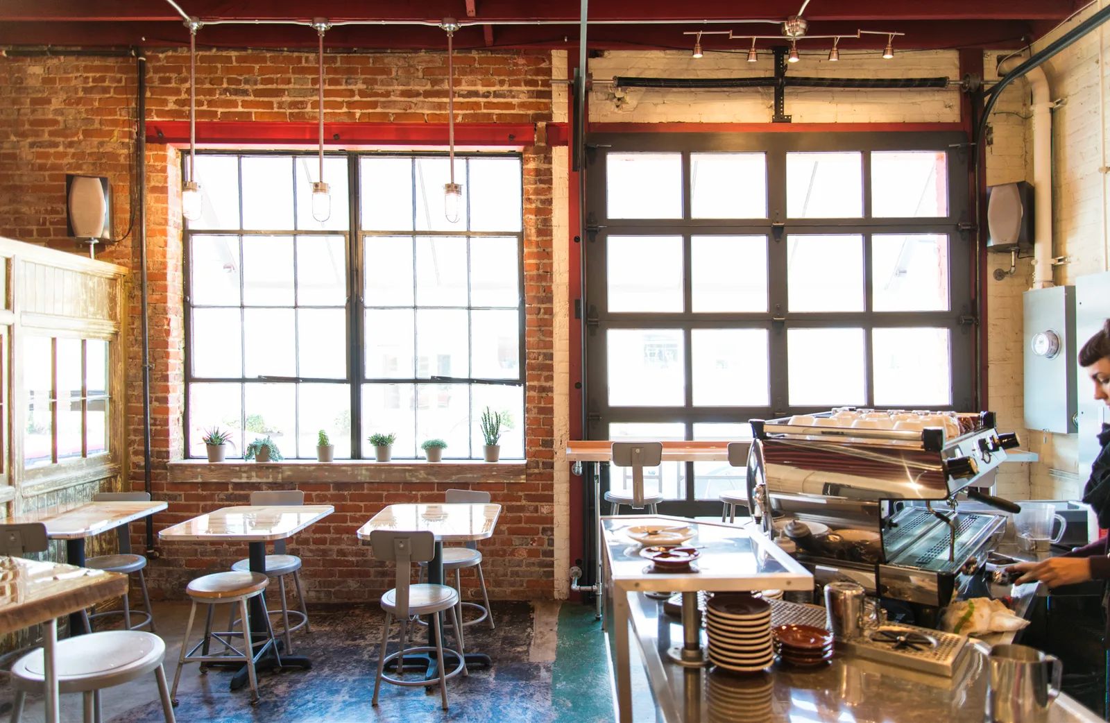 industrial brick café with large windows, counter seating, and coffee bar setup., lamplighter roasting company roast lab, vir