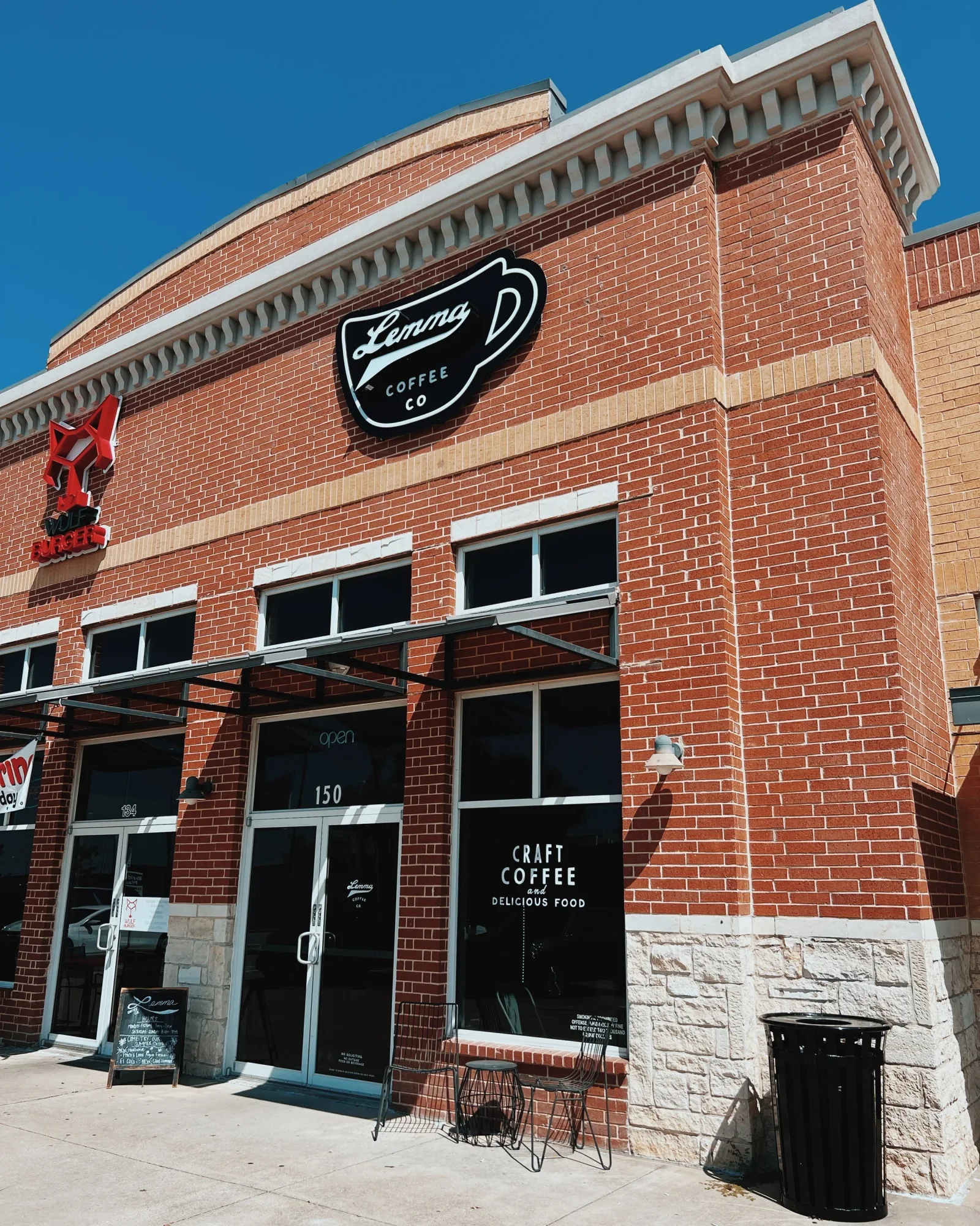 lenny d coffee co storefront with brick facade and craft coffee signage., lemma coffee co, mckinney