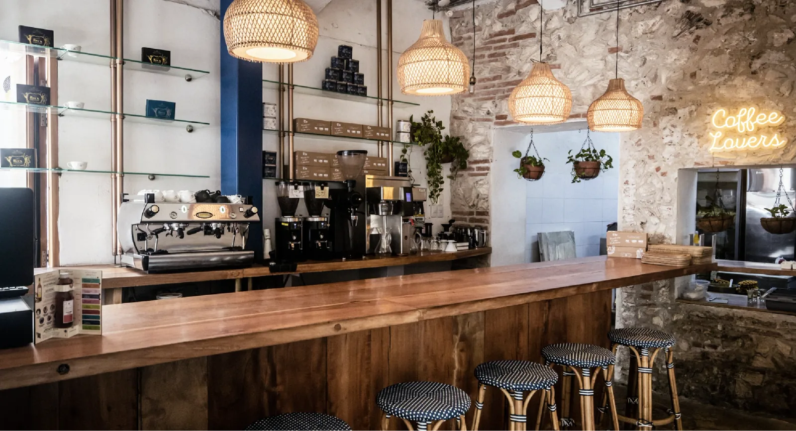 modern coffee shop interior with woven pendant lights and exposed brick walls., libertario coffee roasters cartagena, cartage