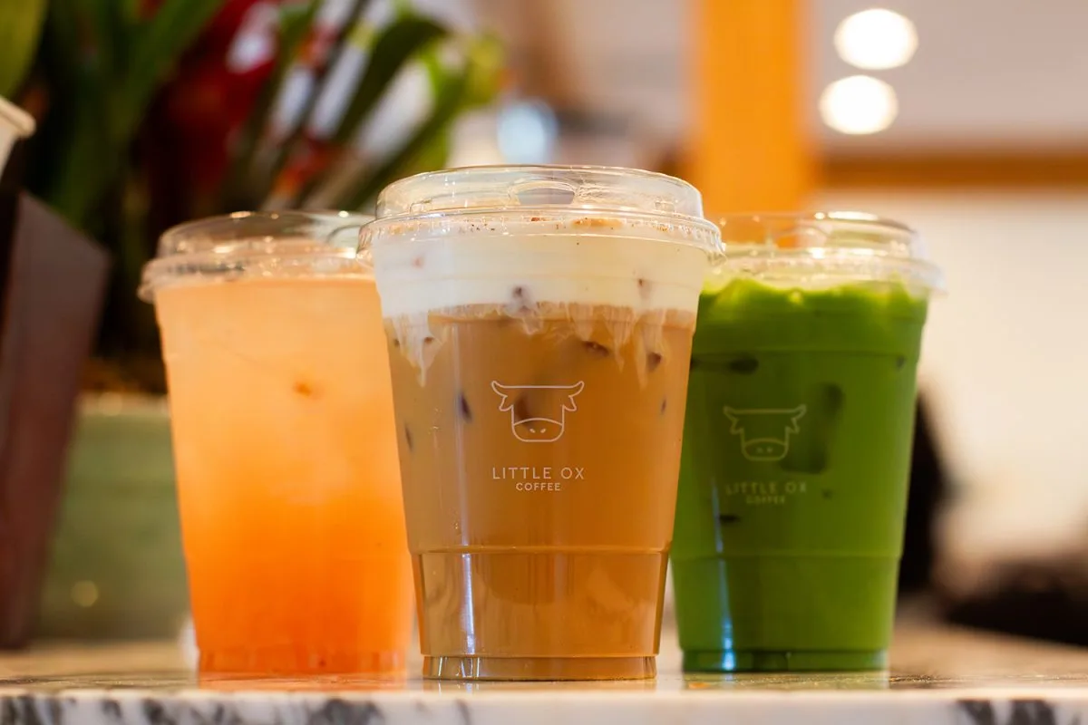 three colorful beverages in clear cups at little ox coffee shop counter., little ox coffee, fullerton