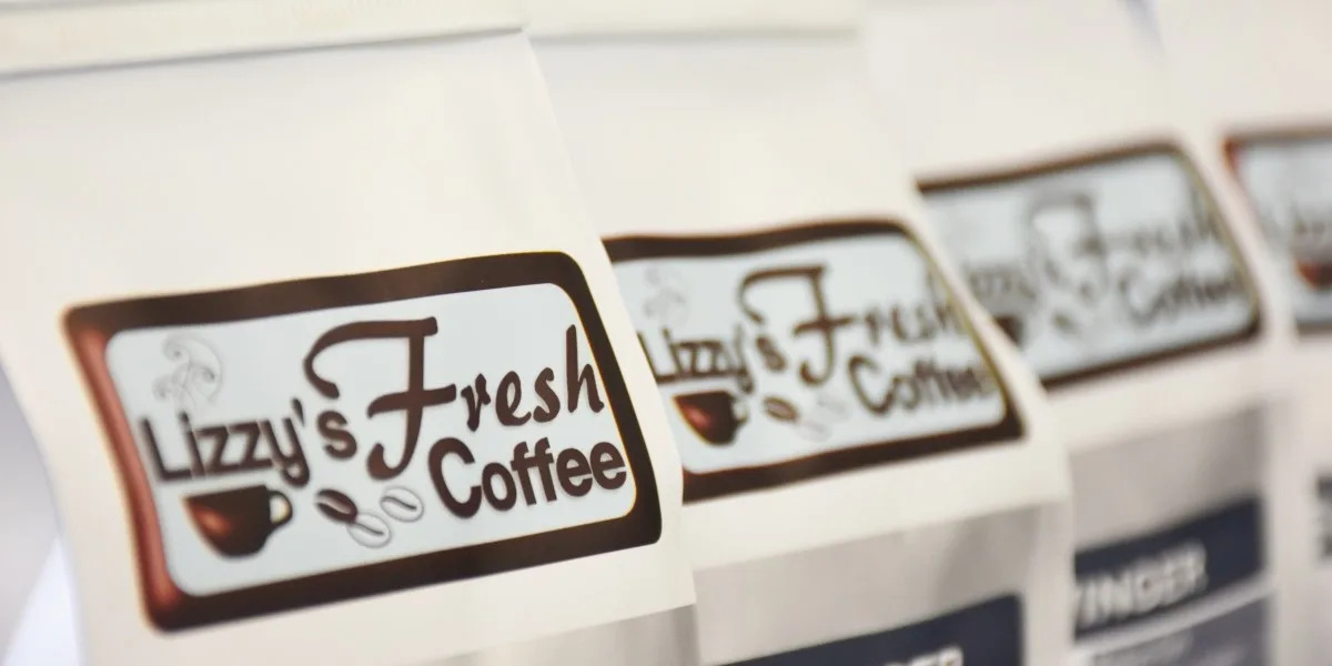 lizzy's fresh coffee branded labels on white packaging with coffee cup graphics., lizzy's fresh coffee, idaho