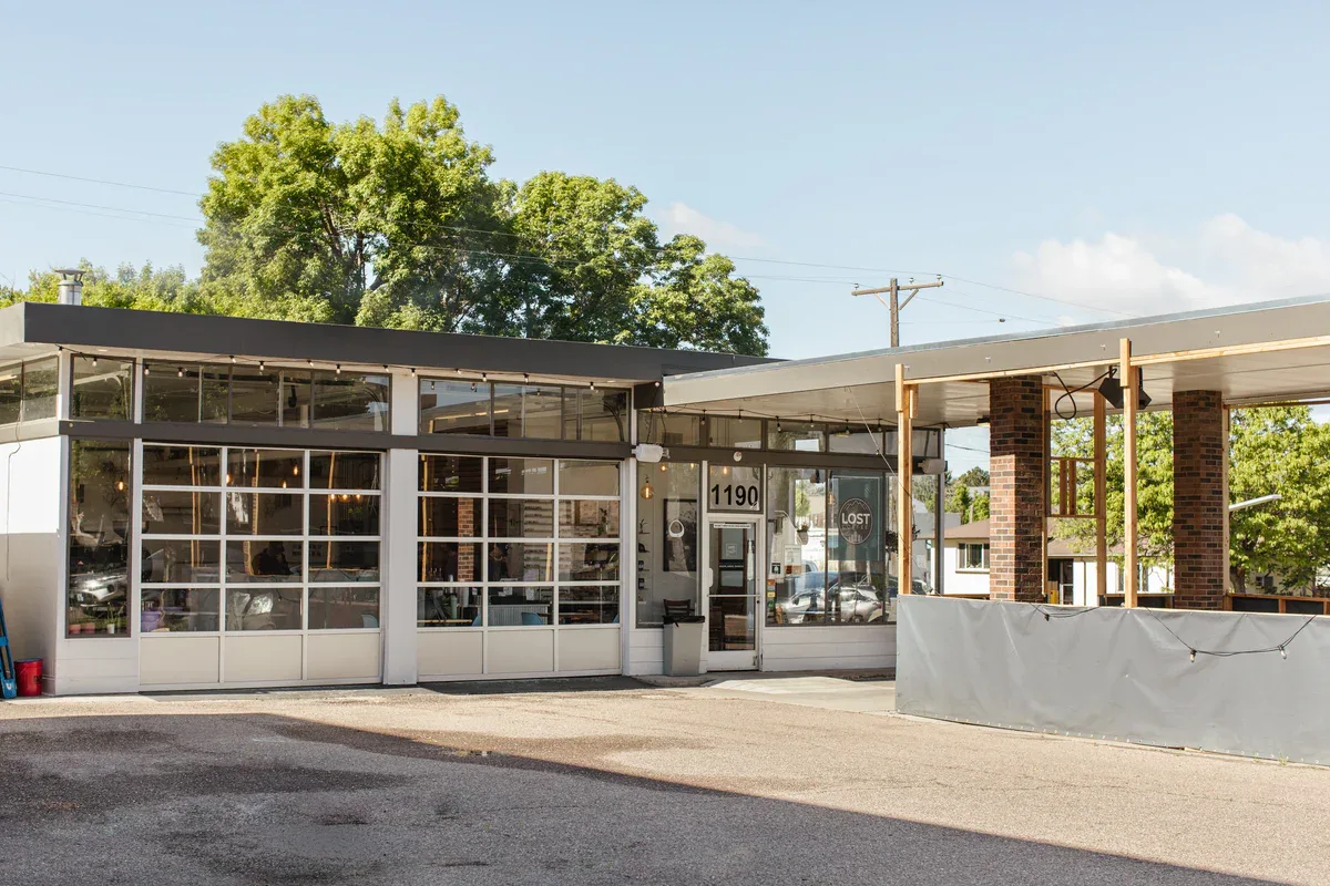 modern storefront with large windows, address 1190, brick structure, clear day., lost coffee, littleton