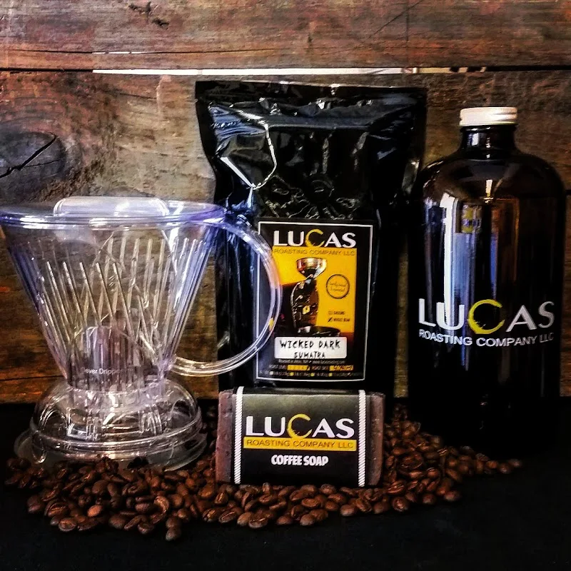 lucas roasting company coffee products arranged with pour-over dripper and beans., lucas roasting company, llc, wolfeboro