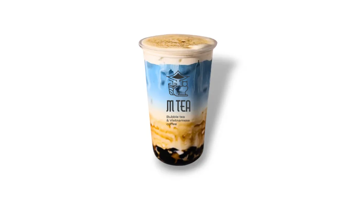 clear plastic cup containing layered bubble tea with dark boba pearls and creamy top., m tea, helsinki