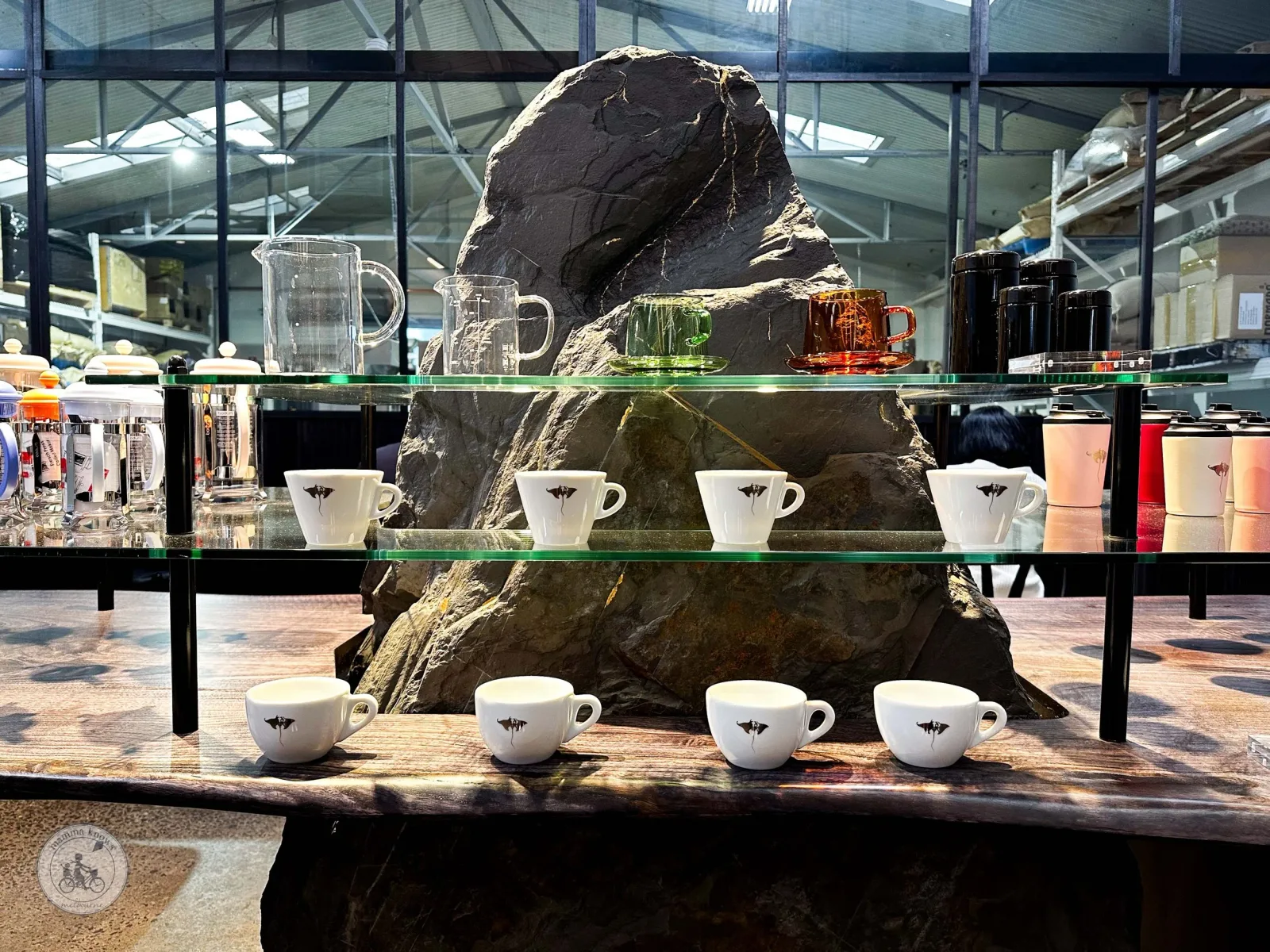 large rock centerpiece with white coffee cups and glass shelving display., manta ray coffee roasters, nunawading