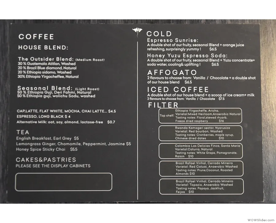 coffee shop menu board displaying beverages, blends, teas, cakes, and pastries offerings., manta ray coffee roasters, nunawad