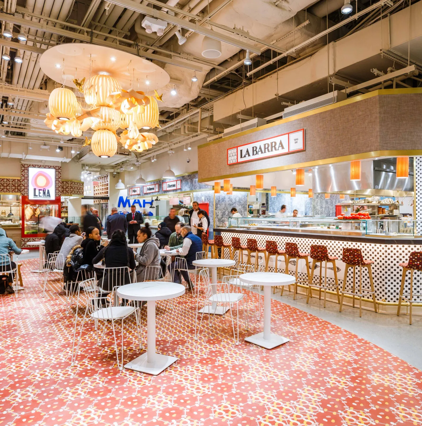 modern food court with spanish restaurant "la barra" and colorful retro design elements., mercado little spain, new york city