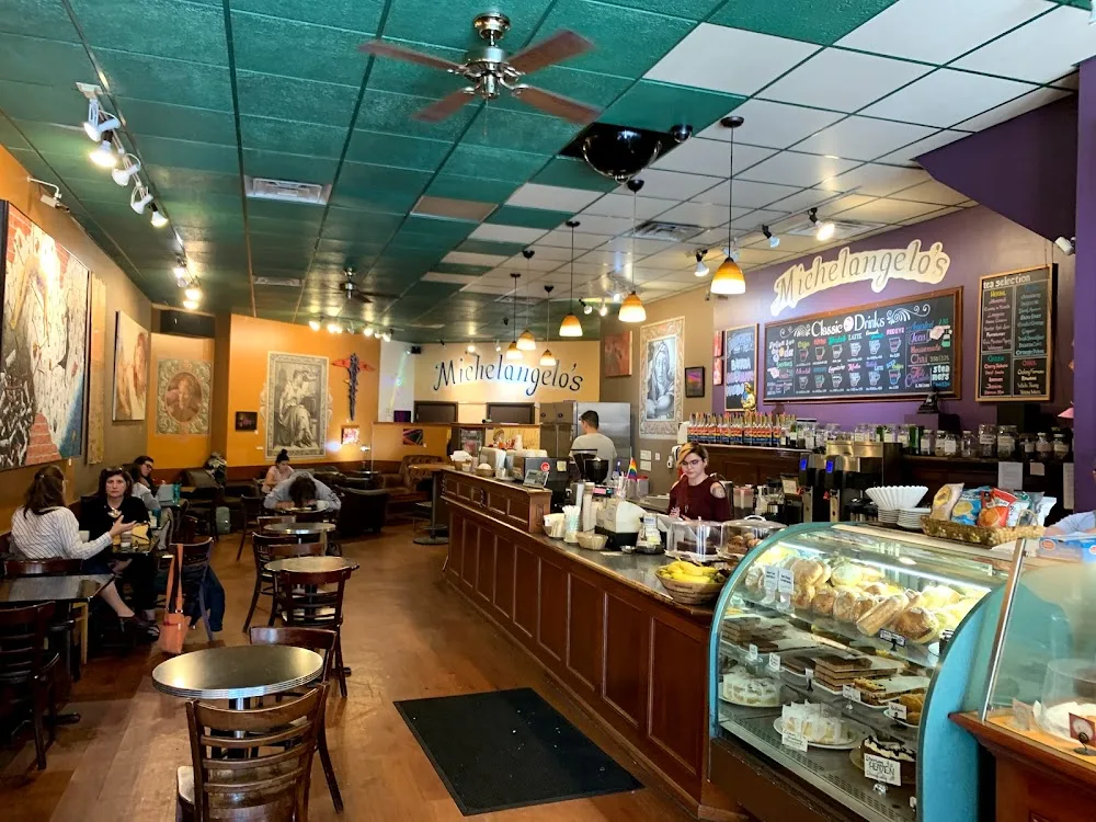 michelangelos café interior with counter, pastry display case, and seated customers., michelangelo's coffee house, madison
